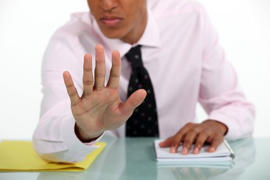 Businessman making a stop gesture