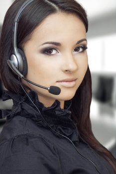 beautiful girl with a headset looking at the camera 