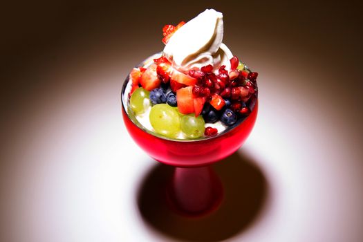 Delicious desserts with toppings of fruits and cream