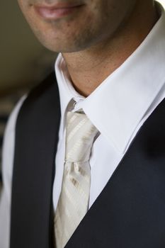 Clopse up picture of a groom getting ready