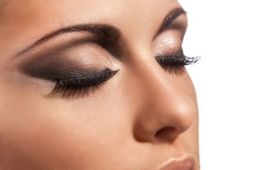 Closeup image of beautiful young caucasian woman with evening makeup