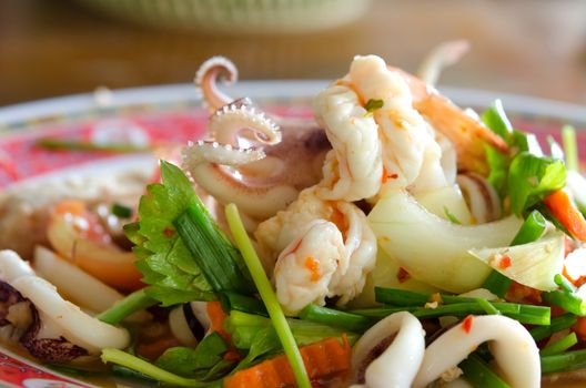 close up spicy mix salad with seafood  ,sausage and vegetable