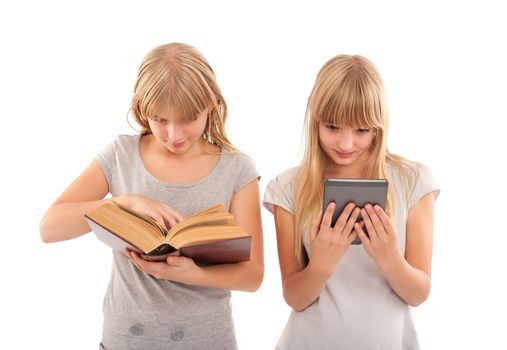 Two girl reading books - traditonal and ebook ones.