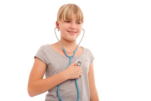 Self check - Young female checking herself with a stethoscope