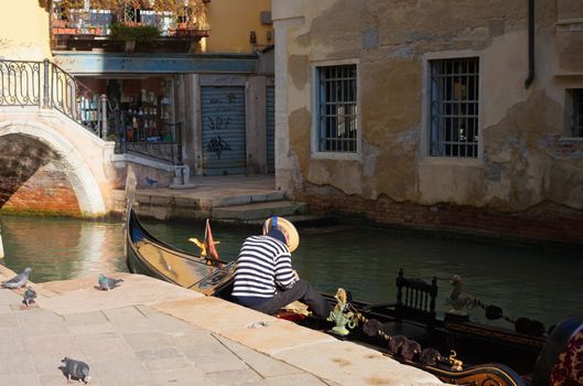Resting gondolier in Venice, Italy