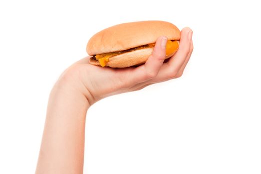 Hand hold a cheeseburger isolated on white