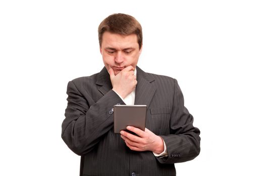 Middle-aged businessman reading an ebook reader attentively