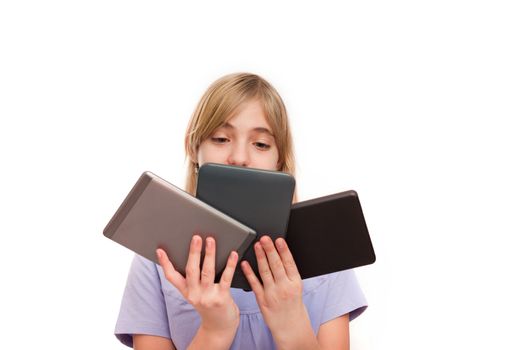 Ebook readers and tablets - Young girl holding different types of ebook readers and tablets. Isolated on white.