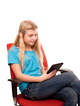 Sitting young female reading a tablet. Isolated on white.