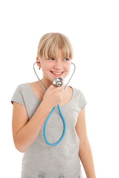 Young female speaking in a stethoscope. Isolated on white
