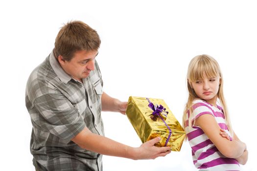 Father trying to give a christmash gift to his daughter but she rejects it. Isolated on white background.