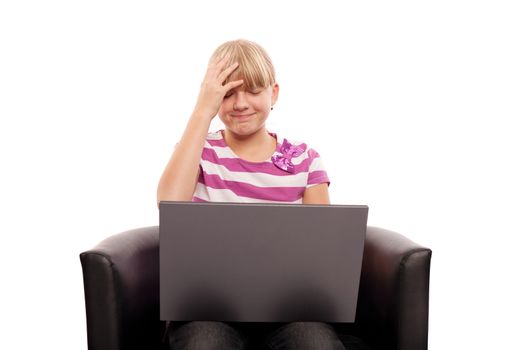 Girl working on her laptop realizes something