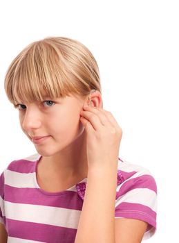 Hearing aid setting - Young Girl putting on her hearing aid. Isolatoed on white.