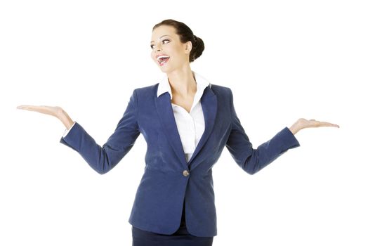 Happy young business woman showing copy space on her palm, isolated on white