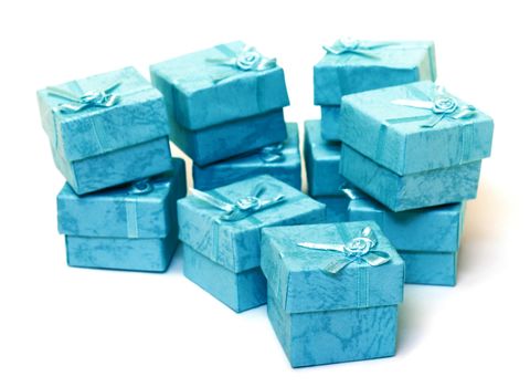 Cyan gift boxes closeup on white background