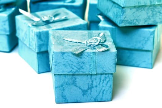 Cyan gift boxes closeup on white background