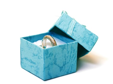 Cyan gift boxes with ring closeup on white background