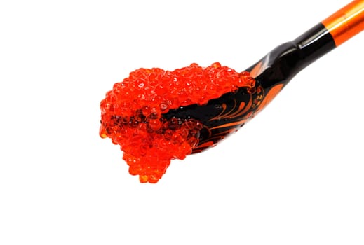 Red salted caviar with wooden spoon on a white background