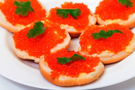 Sandwiches with red salted caviar, on a white background