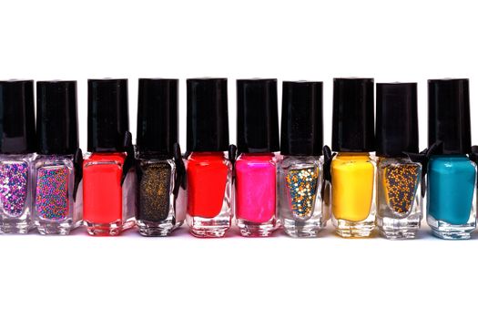 Group of bright nail polishes on white background