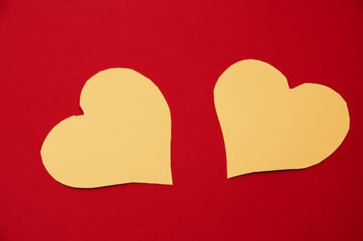 yellow hearts on red background