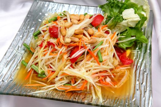 Thai papaya salad serve with vegetables