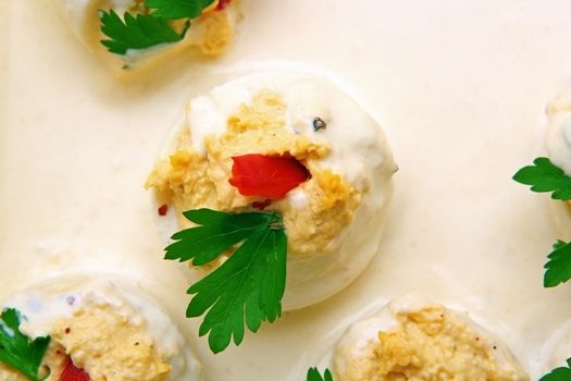 easter stuffed eggs - traditional food with parsley and mayonnaise