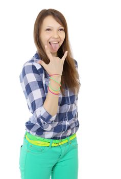 Teenage girl shows tongue and makes hand horns. Mint-colored pants and a plaid shirt. two identical belts in complimentary colours.  One person, teenager, female, caucasian appearance, isolated image on a white background.