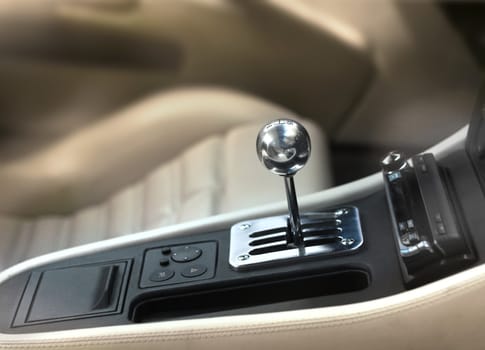 Sports car interior, chromed manual gearshift stick knob
