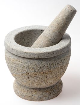 Stone mortar and pestle isolated on white