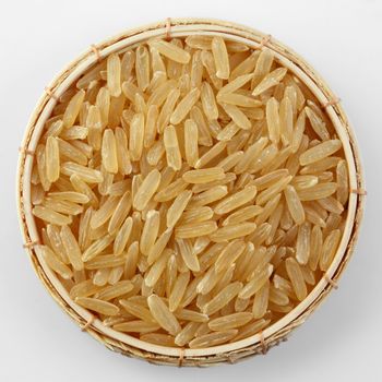 Thai jasmine GABA rice (Germinated Brown Rice) in bamboo basket isolated on white