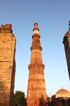 qutub minar with unconstructed gate and tomb