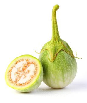 Whole and cut eggplants isolated on white