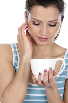 Model Released. Woman Drinking a Cup of Tea