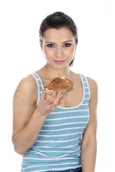 Model Released. Woman Eating Buttered Toast