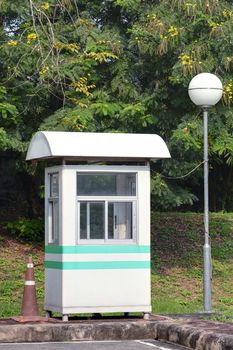 White Sentry box at the coner of car park