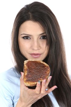 Model Released. Woman Eating Marmite on Toast