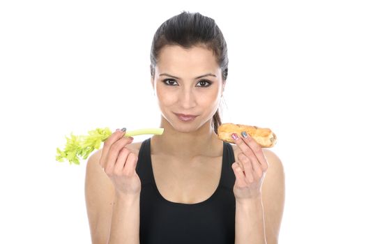 Model Released. Woman Holding Celery and a Sausage Roll