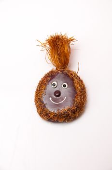 Smiling coconut magnet to hang on the refrigerator from home