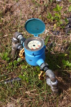 Blue Water meter in morning sunlight