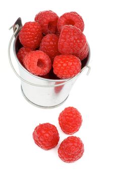 Tin Bucket with Perfect Ripe Raspberries isolated on white background
