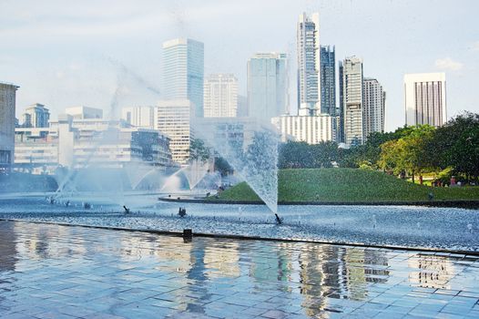 Central park in Kuala Lumpur, fountains in front of Petronas Twin Towers