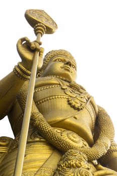 Low angle shot Statue of hindu god Muragan at Batu caves, Kuala-Lumpur, Malaysia, isolated on white 