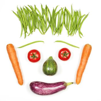 Happy face with vegetables on white background