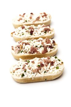 meat and cheese paninis on a white background