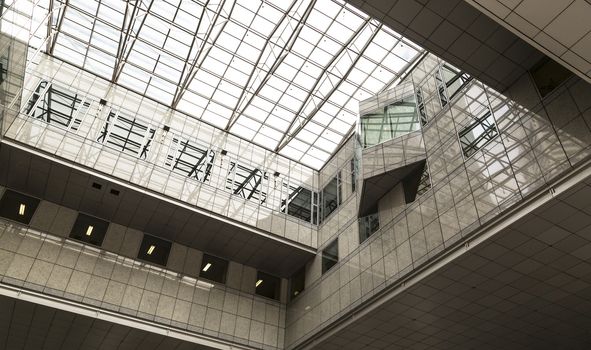 A high angle show of a glass ceiling in an office building.