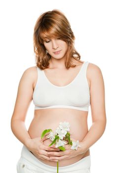 Pregnant woman looking down holding flower isolated on white
