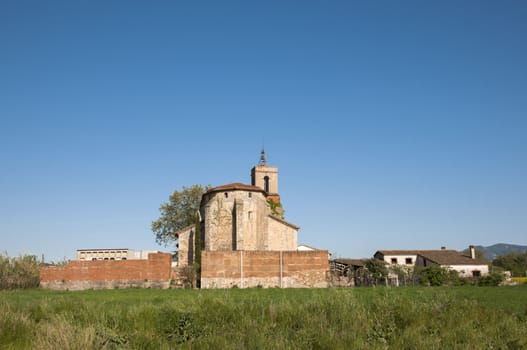 ancient church surrounded by vegetation Granollers