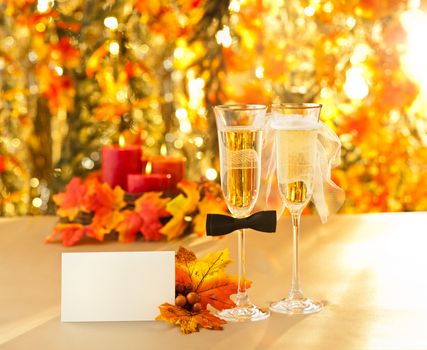 Champagne glasses with conceptual heterosexual decoration for straight couples with place card