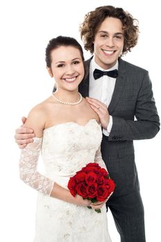 Smiling newlywed couple isolated against white background